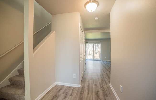 Spacious layout, stairs, and newly renovated wood floors at Westwind Townhomes in Lansing, Michigan