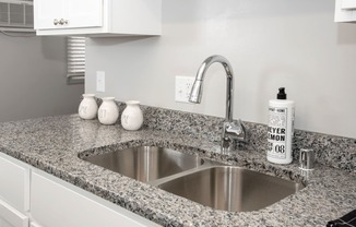 Granite countertops with new plumbing fixtures