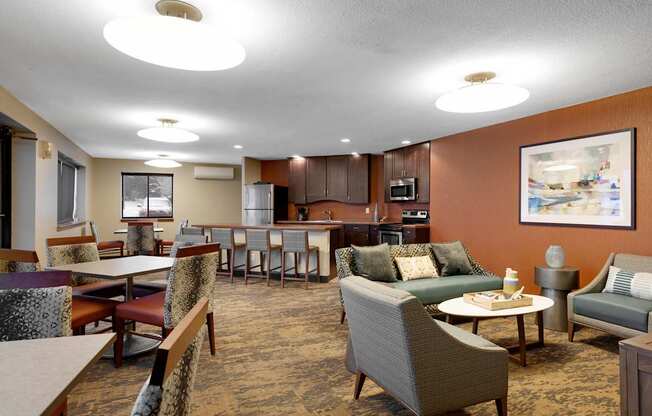 A large room with a dining table and chairs.