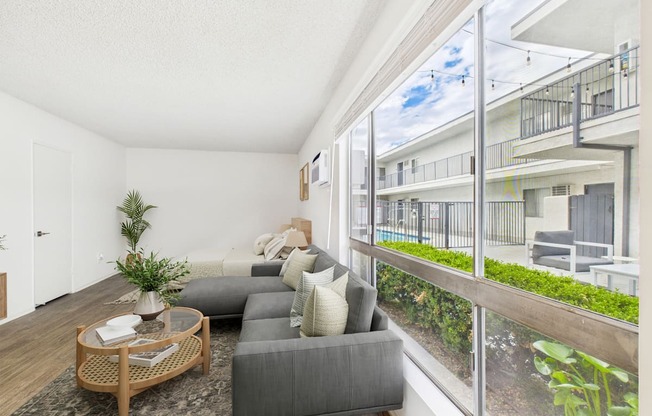 A modern kitchen with a wooden table and chairs.