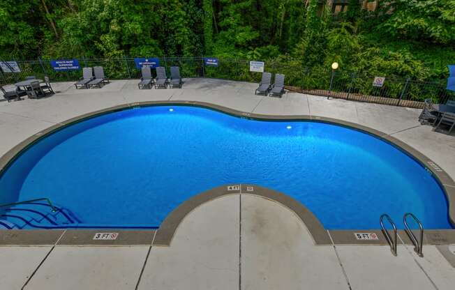 a swimming pool at a resort with a blue pool