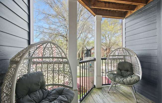 two chairs on a balcony at Elme Druid Hills, Atlanta, Georgia