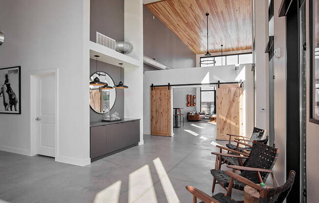 Recreation room with tables and lounge seating areas