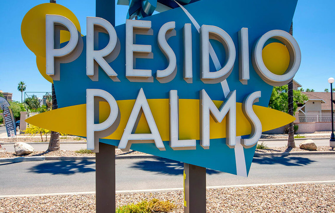 a sign for the Presidio Palms apartment buildingat Presidio Palms Apartments, Tucson