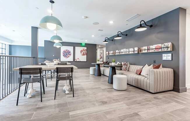 Cozy reading area with extra large sofa and magazine rack at Novel Cary