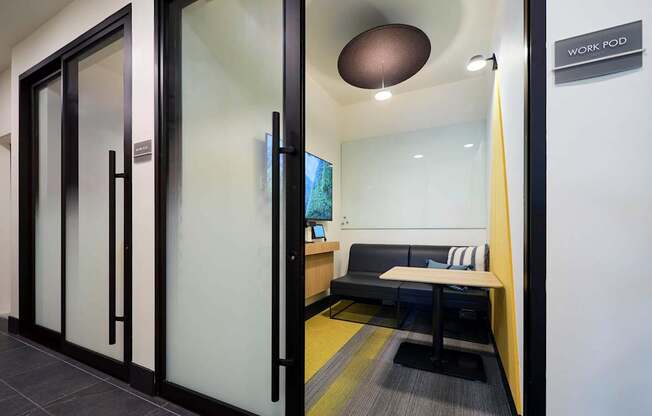 a conference room with a table and a couch