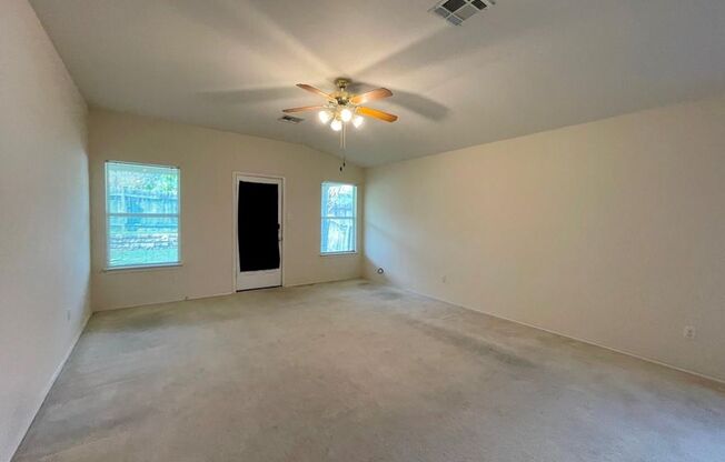 126 Salado Dr in Kyle is a charming single-story brick home nestled in the Silverado at Plum Creek community!