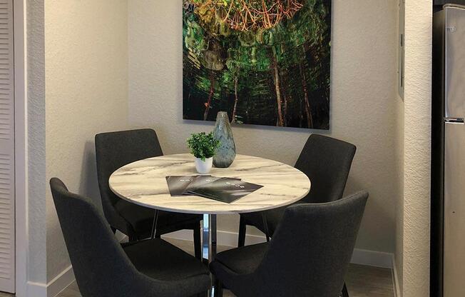 a dining room with a table and chairs at Icon One, Florida, 32114