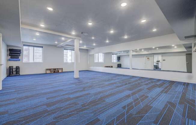 a large room with a carpeted floor and white walls