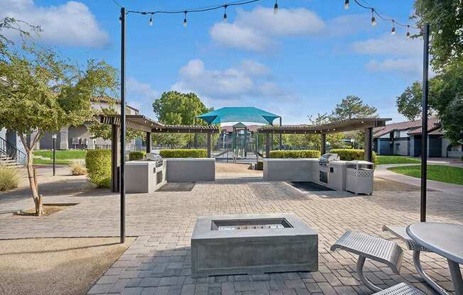 Outdoor Fire Pit Area with Lounge Furniture at Stillwater Apartments located in Glendale, AZ.