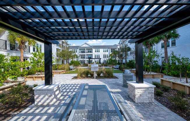 A walkway with a metal grate and a black pole on either side.