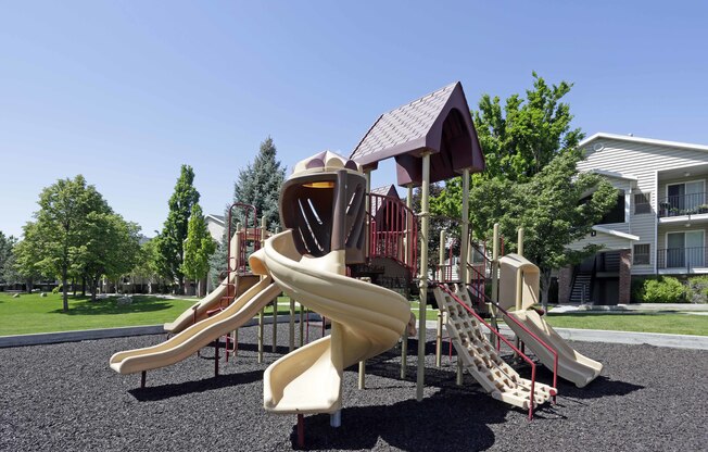 Playground with 4 slides and climbing structure