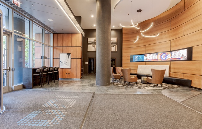 A conference room with a long table and chairs.
