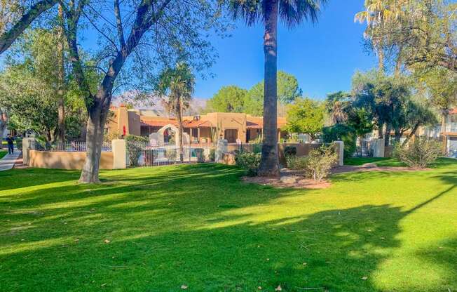 Community  filled with mature trees and lush landscaping at La Hacienda Apartments in Tucson, AZ!