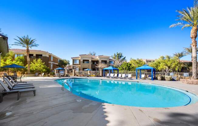 Swimming pool with cabana and seating at The Fairways by Picerne Apartments, Las Vegas, NV, 89141