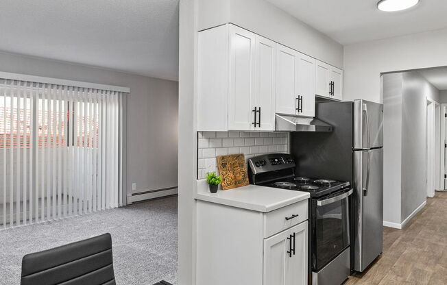 our apartments offer a kitchen and dining area with stainless steel appliances