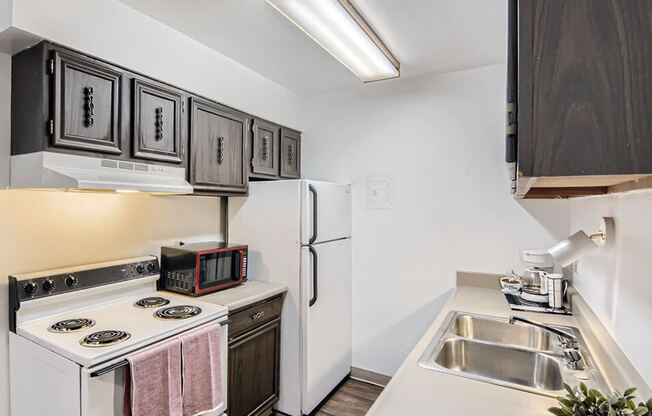 kitchen with storage space at country green apartments