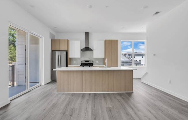 A modern kitchen with a wooden island and stainless steel appliances at The Franklin Marlboro Apartments, Marlboro, NJ 07746