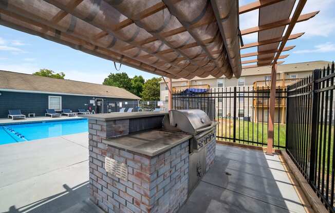 the preserve at ballantyne commons covered patio with grill and pool