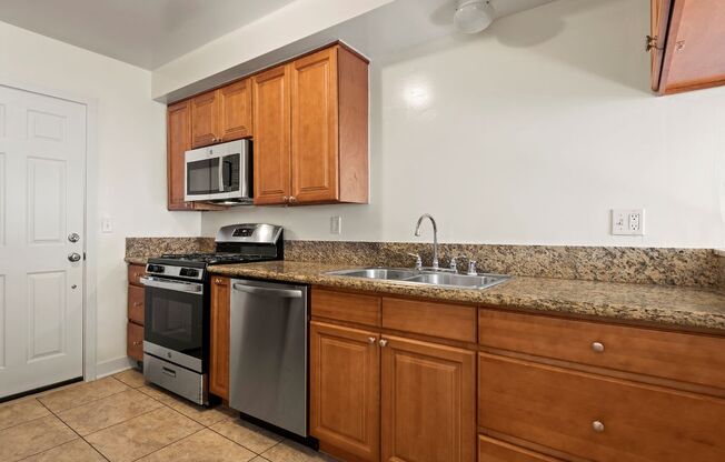 a kitchen with a sink and a counter top