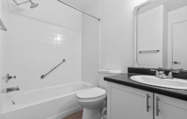 a bathroom with a sink toilet and bathtub