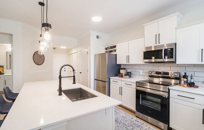 kitchen with white cabinets and stainless steel appliances