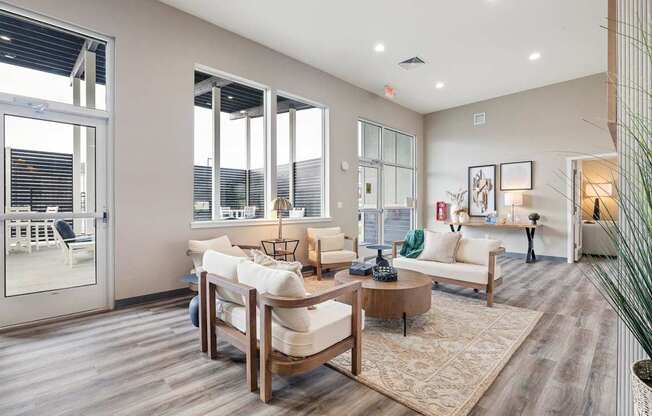 A living room with a white couch and a wooden coffee table.