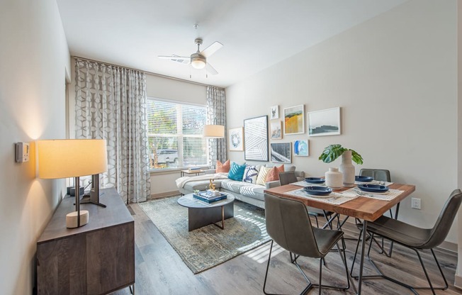 an open living room and dining room with a couch and a table