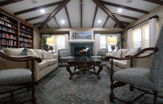 A living room with a fireplace and a bookshelf.