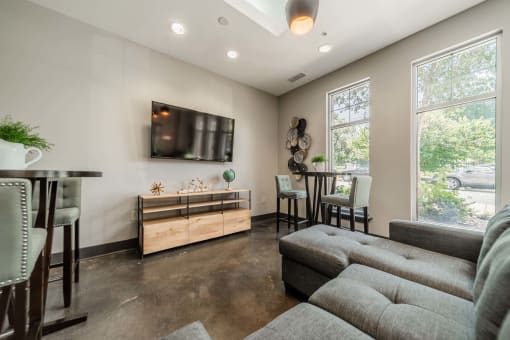 a living room with a couch and a table and a television