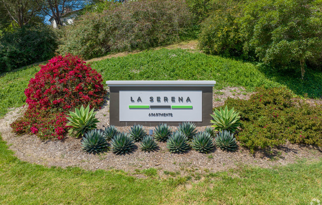 the sign at the corner arriving to La Serena Apartments