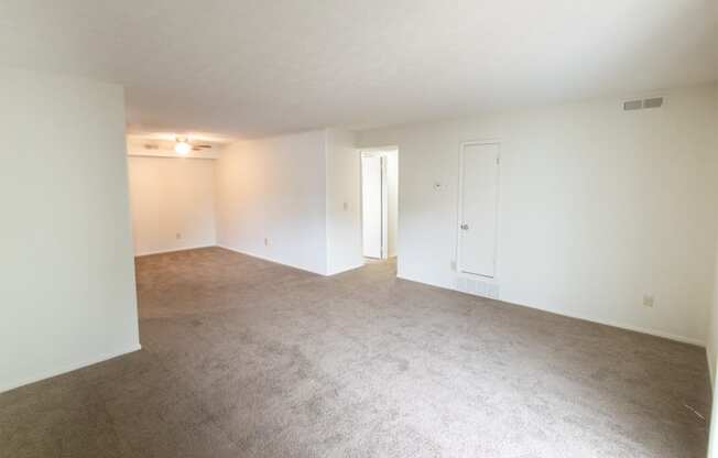 This is a photo of the living room of the 902 square foot, 2 bedroom, 1 and a half bath apartment at Blue Grass Manor Apartments in Erlanger, KY.