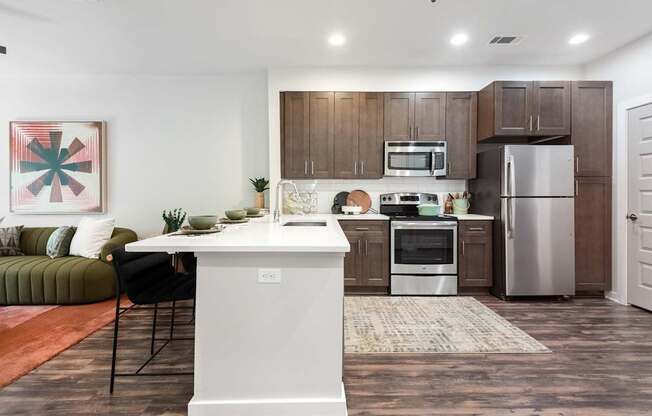 Spacious Kitchen with Sleek Cabinetry and Stainless Steel Finishes