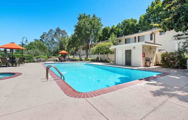 Apartments for Rent in San Jose, CA - Los Gatos Creek - Pool and Spa with Lounge Chairs, Tables and Chairs, Umbrellas, and Beautiful Landscaping