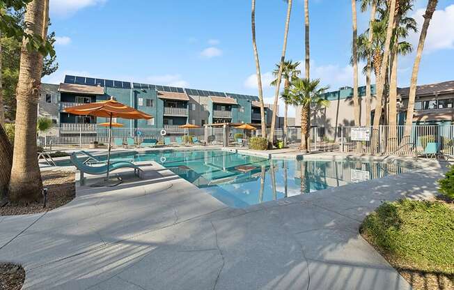 Community Swimming Pool with Pool Furniture at Tanque Verde Apartments located in Tucson, AZ.
