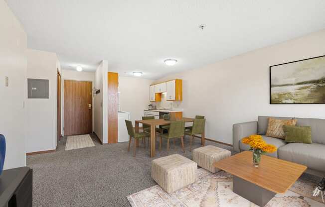 a living room with a couch and a dining room table