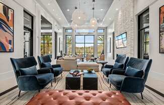 a living room with couches and chairs and a table  at Altis Grand Suncoast Apartments, Florida, 34638