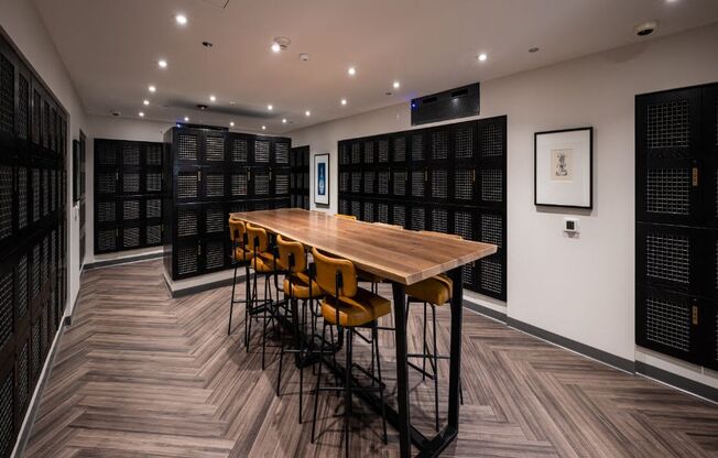 a room with a wooden table and yellow chairs  at The Belden Stratford, Illinois, 60614