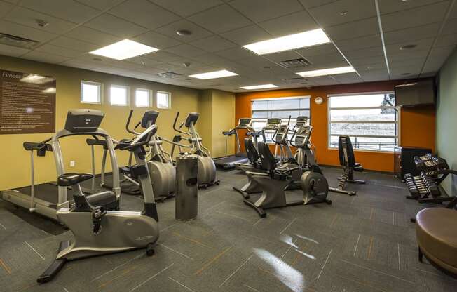 a gym with various exercise equipment in a building