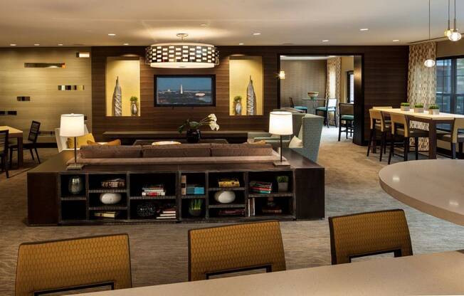 Contemporary Club Room with TV, Bar Area and More