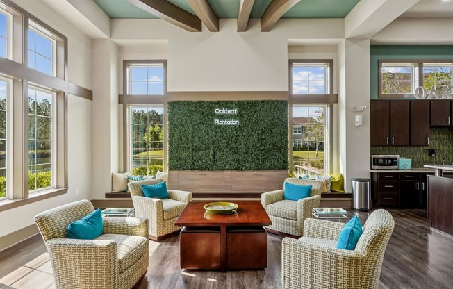 A living room with a green wall and wicker chairs.