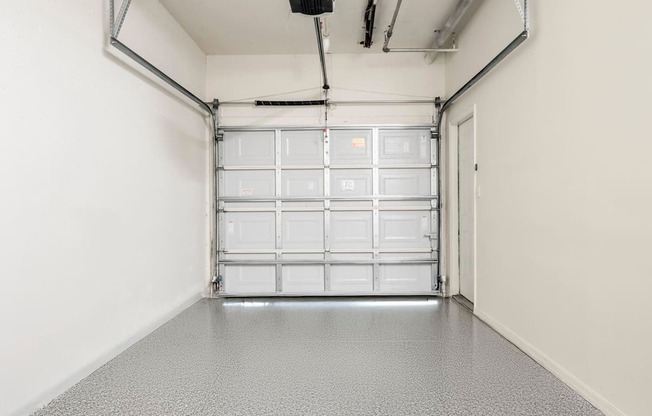 Clean garage interior with polished floor and automatic door