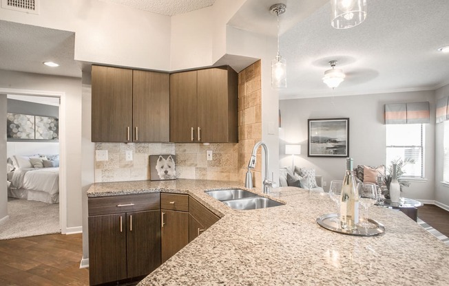 a kitchen with granite counter tops and a sink