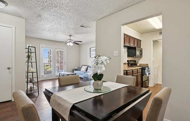 A dining room with a table set for two.