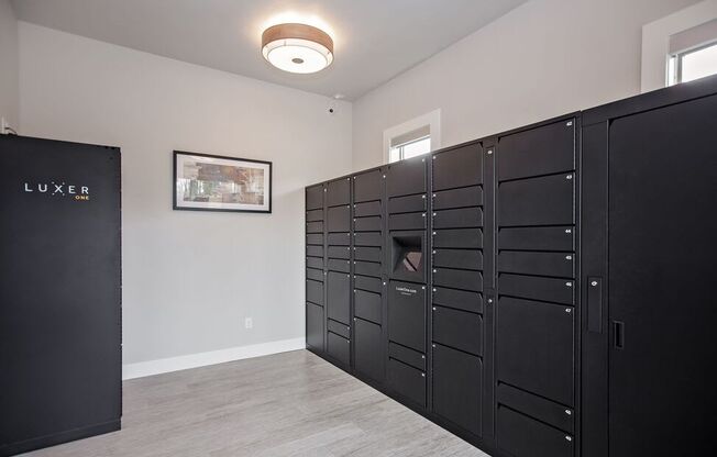 a room with several lockers and a picture on the wall