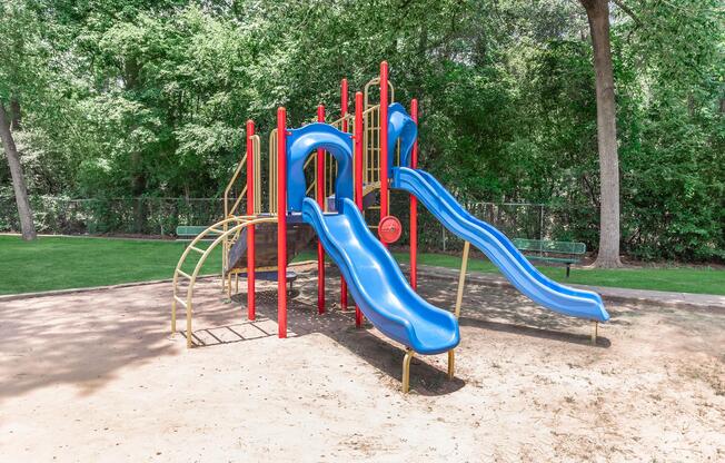 a playground with a blue chair