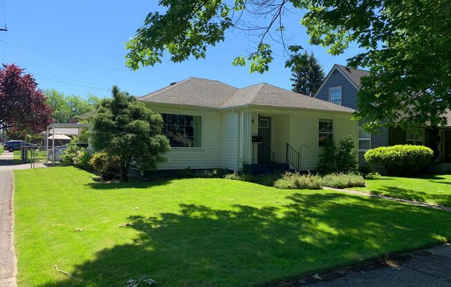 Model three bedroom home, with well-maintained yard & attached garage!