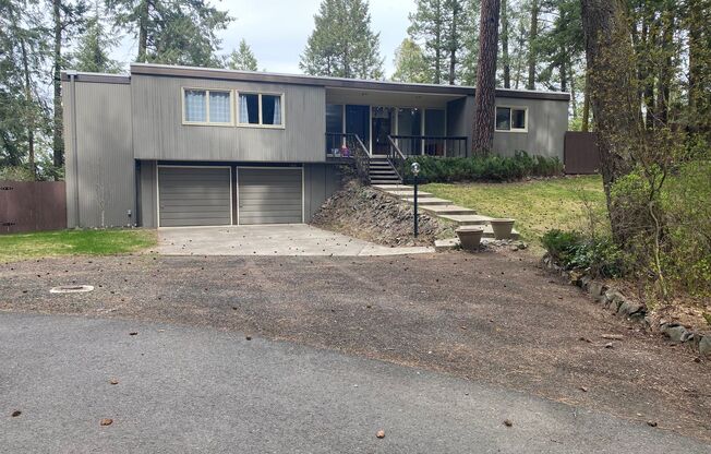 Unique View Property 3 bed, 3 bath located near the Kalispel Golf & Country Club & Whitworth. You must see this one!