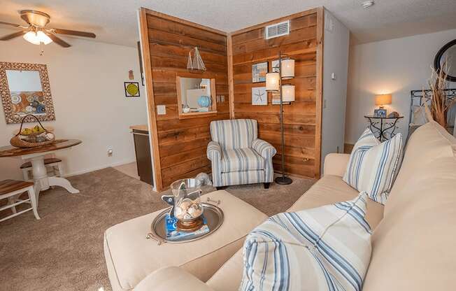 a living room with couches and chairs