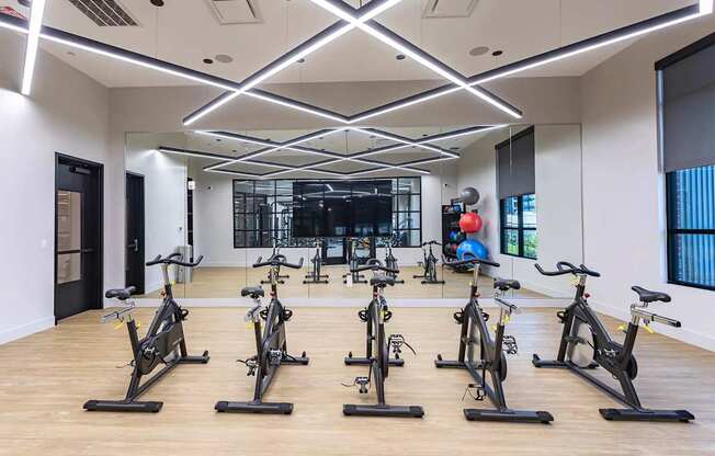 the gym has a large amount of exercise bikes
